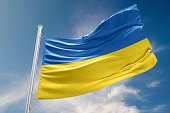 Ukrainian Flag is Waving Against Blue Sky