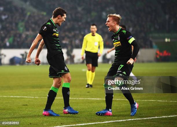 Andreas Christensen of Borussia Moenchengladbach celebrates with Oscar Wendt after scoring a goal during the UEFA Europa League Round of 16 second...