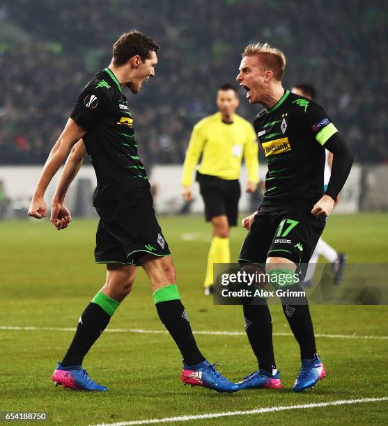 Andreas Christensen of Borussia Moenchengladbach celebrates with Oscar Wendt after scoring a goal during the UEFA Europa League Round of 16 second...