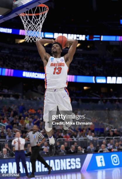 Kevarrius Hayes of the Florida Gators dunks the ball against the East Tennessee State Buccaneers during the first round of the 2017 NCAA Men's...