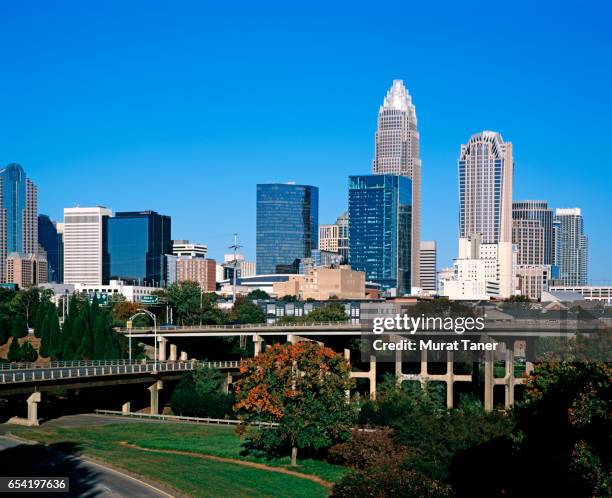 skyscrapers in downtown charlotte - charlotte north carolina skyline stock pictures, royalty-free photos & images