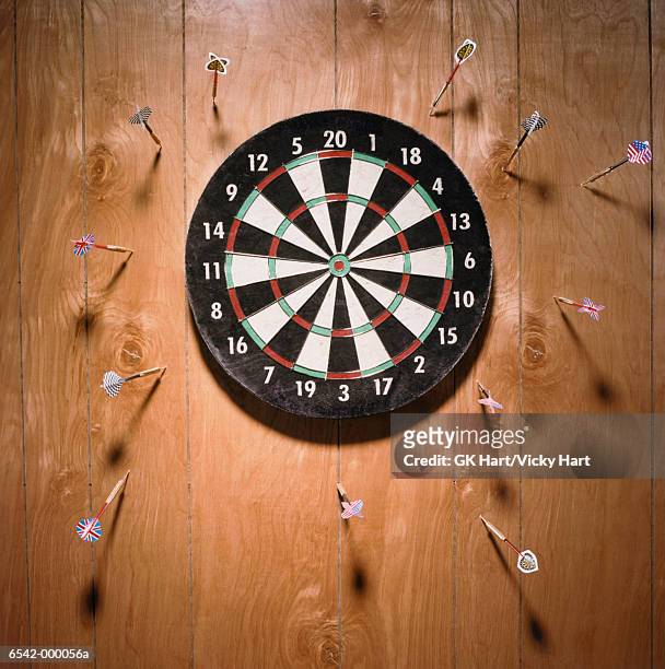 darts in wall - bull's eye stock pictures, royalty-free photos & images