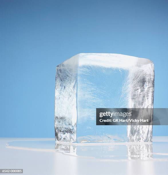 cube of melting ice - ice cube stock-fotos und bilder