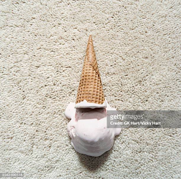 ice cream and cone on carpet - kids mess carpet fotografías e imágenes de stock