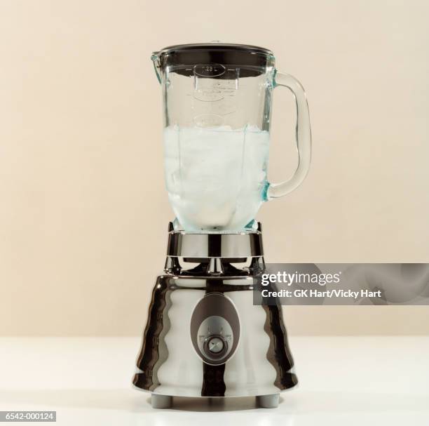 ice cubes and water in blender - liquidiser stock pictures, royalty-free photos & images