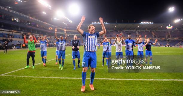 Genk's Sander Berge celebrates with teammates after winning the UEFA Europa League football match between Genk and Gent on March 16, 2017 in Genk. /...