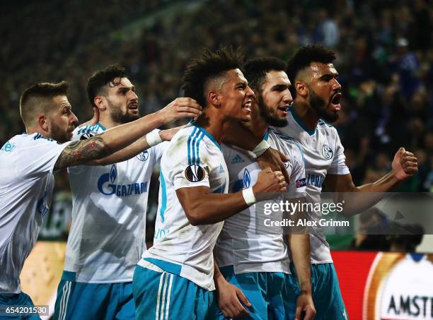 Nabil Bentaleb of Schalke 04 celebrates after scoring a penalty goal during the UEFA Europa League Round of 16 second leg match between Borussia...