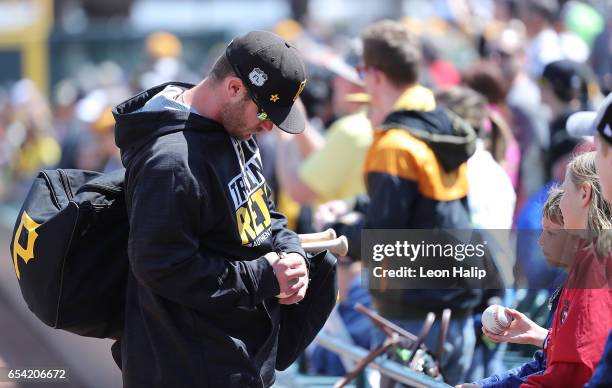 Joey Terdoslavich of the Pittsburgh Pirates signs autographs for the fans prior to the start of the Spring Training Game against the Baltimore...