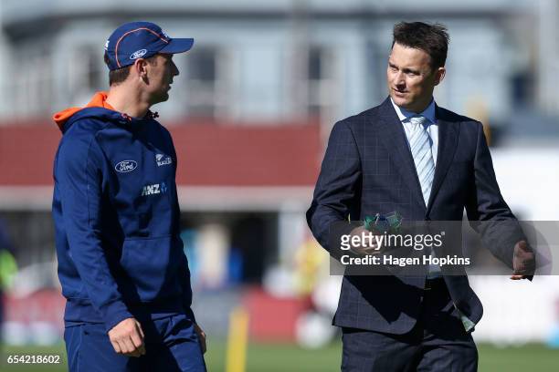 Matt Henry of New Zealand speaks to former New Zealand player Shane Bond during day two of the test match between New Zealand and South Africa at...