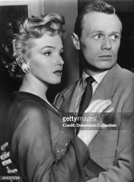 Actors Marilyn Monroe and Richard Widmark pose for a publicity still for the 20th Century Fox film 'Don't Bother to Knock' in 1952 in Los Angeles,...