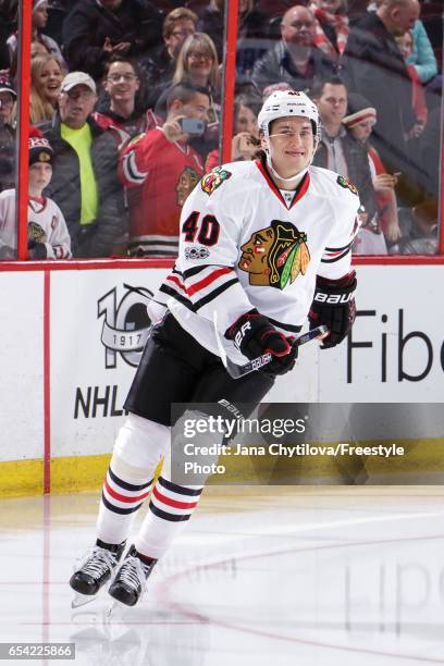 John Hayden the Chicago Blackhawks skates during the warmup before the rest of the team as he makes his NHL debut at Canadian Tire Centre against the...