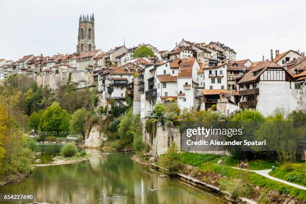 fribourg townscape near saane river, fribourg canton, switzerland - freiburg skyline stock pictures, royalty-free photos & images