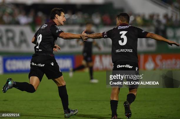 Nicolas Aguirre of Argentina's Lanus, celebrates with teammate Maximiliano Velazquez after scoring against Brazil's Chapecoense, during their...