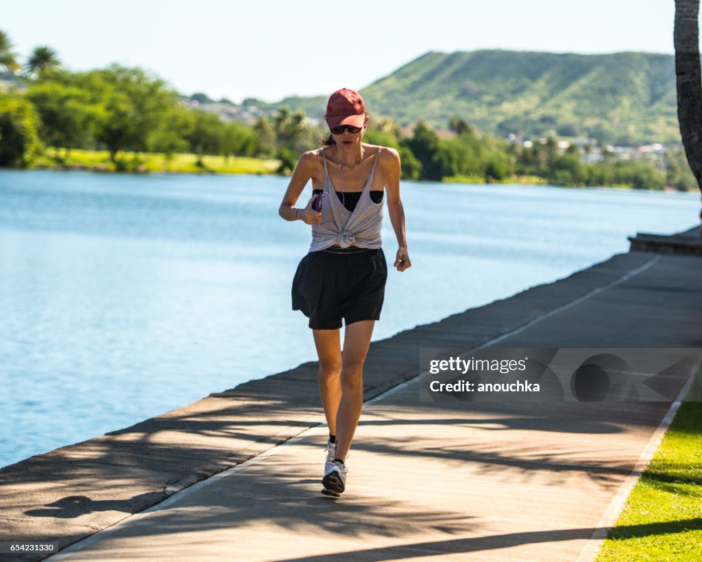 Woman running outdoors, Hawaii, USA