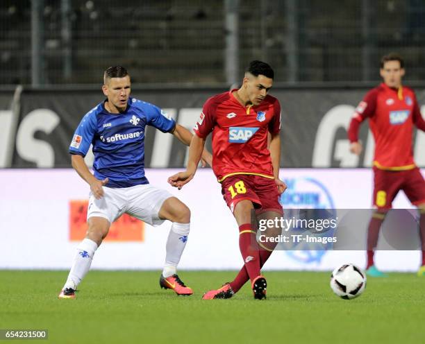 Roman Bezjak of Darmstadt, Nadiem Amiri of Hoffenheim battle for the ball during the Bundesliga match between SV Darmstadt 98 and TSG 1899 Hoffenheim...