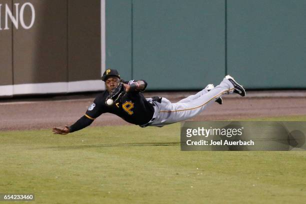 Eury Perez of the Pittsburgh Pirates is unable to catch the ball hit by Brock Holt of the Boston Red Sox which went for a triple in the sixth inning...