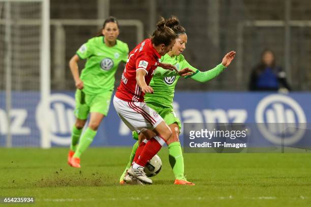 Gina Lewandowski of Bayern Muenchen and Vanessa Bernauer of Wolfsburg battle for the ball during the Women's DFB Cup Quarter Final match between FC...