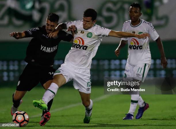 Nathan of Chapecoense struggles for the ball with Alejandro Silva of Lanus during a match between Chapecoense and Lanus as part of Copa Bridgestone...