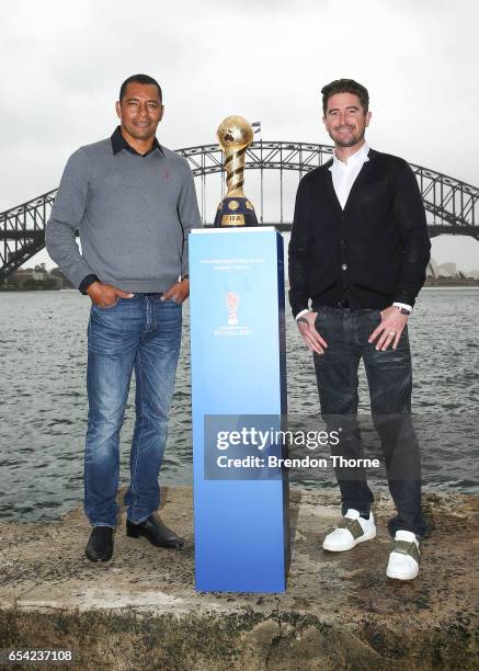 Gilberto Silva and Harry Kewell pose with the 2017 FIFA Confederations Cup at Blues Point Reserve on March 17, 2017 in Sydney, Australia.