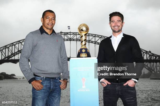 Gilberto Silva and Harry Kewell pose with the 2017 FIFA Confederations Cup at Blues Point Reserve on March 17, 2017 in Sydney, Australia.