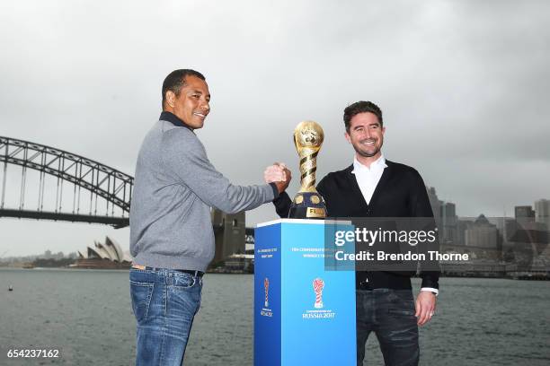 Gilberto Silva and Harry Kewell pose with the 2017 FIFA Confederations Cup at Blues Point Reserve on March 17, 2017 in Sydney, Australia.