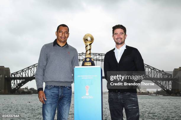 Gilberto Silva and Harry Kewell pose with the 2017 FIFA Confederations Cup at Blues Point Reserve on March 17, 2017 in Sydney, Australia.