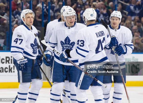 Leo Komarov, Alexey Marchenko, Morgan Rielly, Nazem Kadri, and Connor Brown of the Toronto Maple Leafs celebrate a goal during the second period...