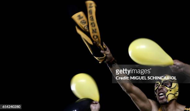Supporters of Bolivia's The Strongest cheer for their team during their Libertadores Cup football match against Brazil's Santos held at the Vila...