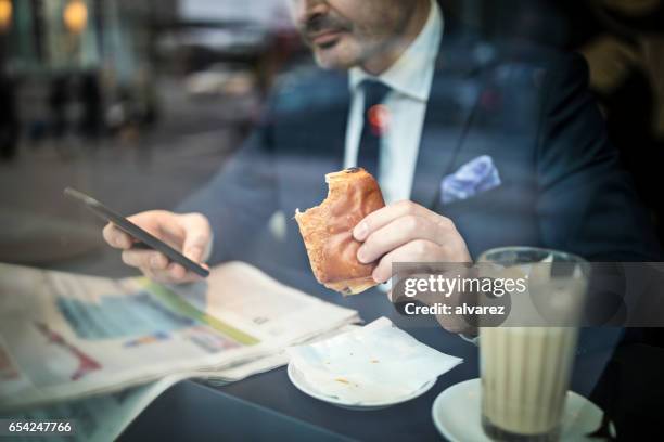 Man Eating Paper Photos and Premium High Res Pictures - Getty Images
