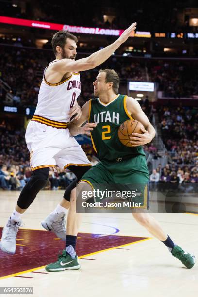 Kevin Love of the Cleveland Cavaliers guards Joe Ingles of the Utah Jazz during the second half at Quicken Loans Arena on March 16, 2017 in...