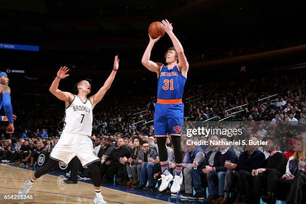 Ron Baker of the New York Knicks shoots the ball during the game against the Brooklyn Nets on March 16, 2017 at Madison Square Garden in New York...