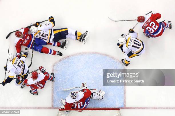 Kevin Shattenkirk of the Washington Capitals and Cody McLeod of the Nashville Predators battle for the puck during the second period at Verizon...
