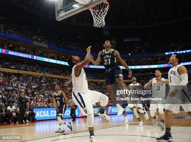 Villanova Wildcats forward Kris Jenkins is fouled by Mount St. Mary's Mountaineers guard Greg Alexander during the NCAA Division I Men's Basketball...