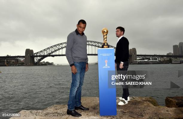 Former Brazilian football player Gilberto Silva and former Australian football player Harry Kewell pose for photos with the 2017 FIFA Confederations...