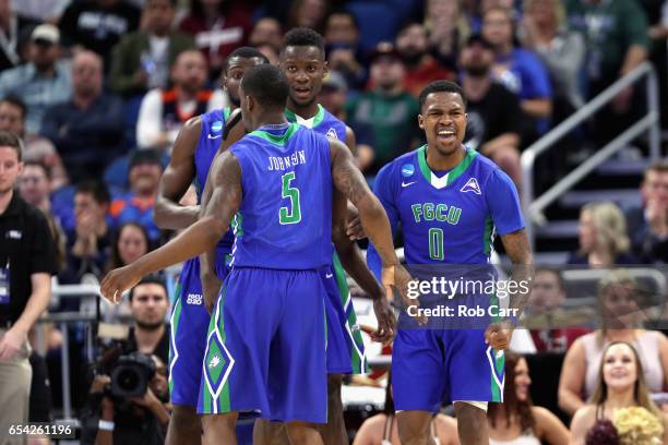 Brandon Goodwin of the Florida Gulf Coast Eagles celebrates with teammates in the first half against the Florida State Seminoles during the first...