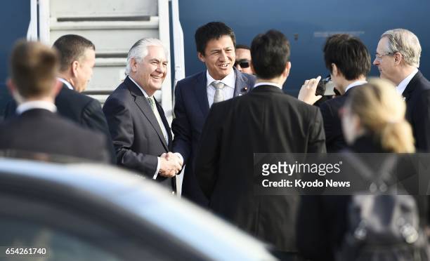 Secretary of State Rex Tillerson is seen off by Japanese officials at Tokyo's Haneda airport before leaving for South Korea on March 17, 2017....