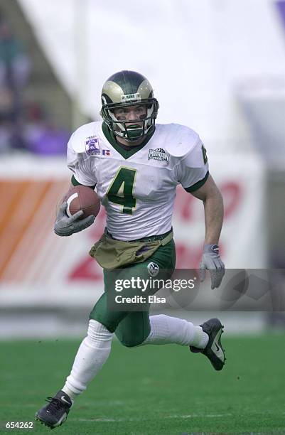 Pete Rebstock of Colorado State carries the ball after a fake punt for the first down against Louisville during the first half of the Liberty Bowl in...