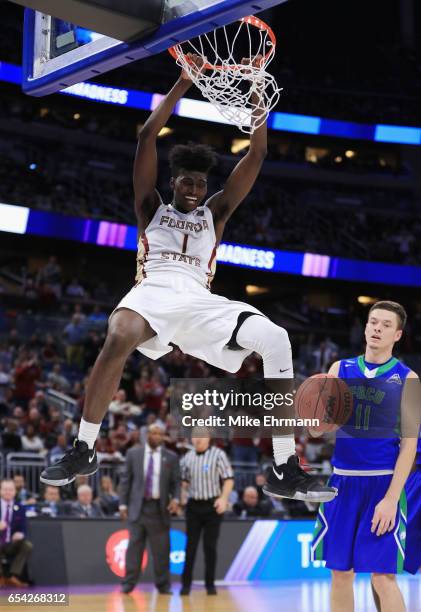 Jonathan Isaac of the Florida State Seminoles dunks the ball in the second half against the Florida Gulf Coast Eagles during the first round of the...