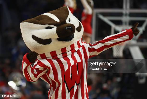 Bucky Badger, the Wisconsin Badgers mascot, performs in the first half against the Virginia Tech Hokies during the first round of the 2017 NCAA Men's...