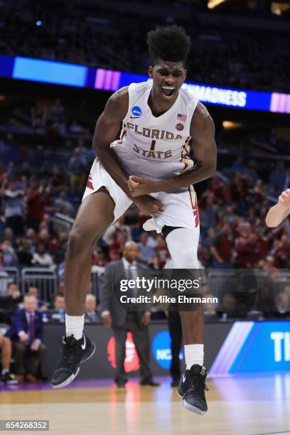 Jonathan Isaac of the Florida State Seminoles reacts after dunking the ball in the second half against the Florida Gulf Coast Eagles during the first...