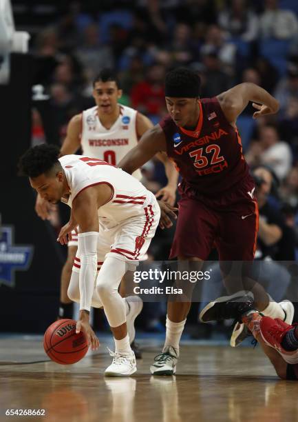 Jordan Hill of the Wisconsin Badgers tries to control the ball against Zach LeDay of the Virginia Tech Hokies in the first half during the first...