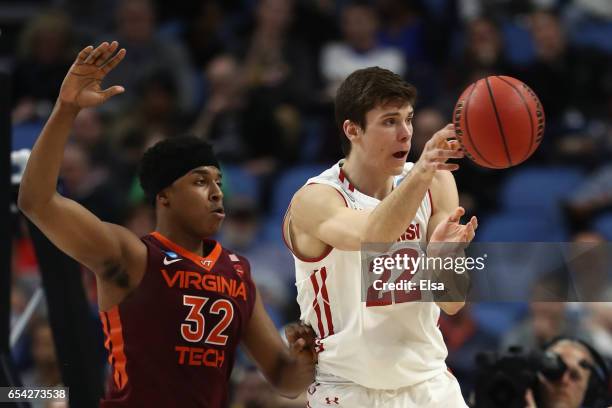 Zach LeDay of the Virginia Tech Hokies defends against Ethan Happ of the Wisconsin Badgers in the second half during the first round of the 2017 NCAA...