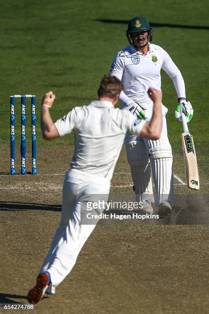 Jimmy Neesham of New Zealand celebrates after dismissing Quentin de Kock of South Africa during day two of the test match between New Zealand and...