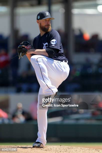 Logan Kensing of the Tigers delivers a pitch to the plate during the spring training game between the Atlanta Braves and the Detroit Tigers on March...