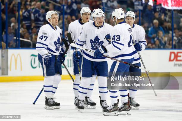 Toronto Maple Leafs defenseman Morgan Rielly celebrates with teammates Nazem Kadri , Leo Komarov , Alexey Marchenko and Connor Brown after scoring a...