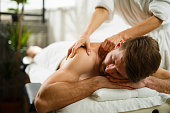 Man having back massage at the health spa.