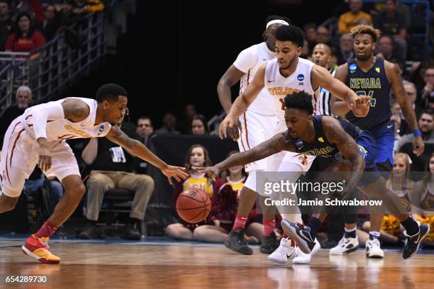 Iowa State Cyclones guard Monte Morris and Nevada Wolf Pack guard Marcus Marshall fight for a loose ball during the 2017 NCAA Photos via Getty Images...