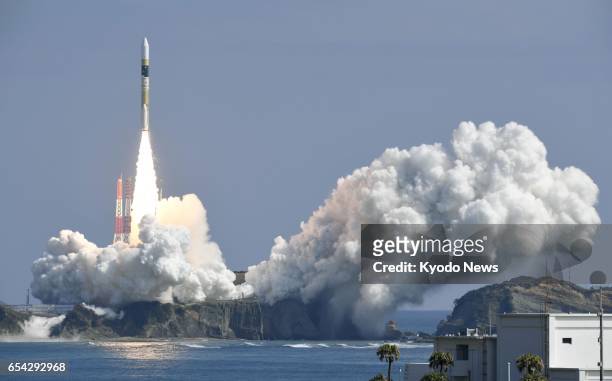 An H-2A rocket carrying a government intelligence-gathering satellite lifts off from the Tanegashima Space Center on Tanegashima Island, southwestern...
