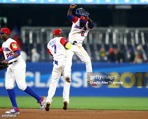 Jose Reyes and Starling Marte of Team Dominican Republic celebrate after defeating Team Venezuela in Game 3 of Pool F of the 2017 World Baseball...