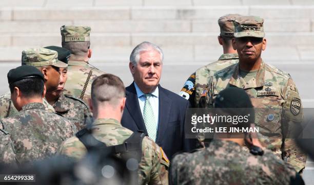 Secretary of State Rex Tillerson walks with US Gen. Vincent K. Brooks, commander of the United Nations Command, Combined Forces Command and United...